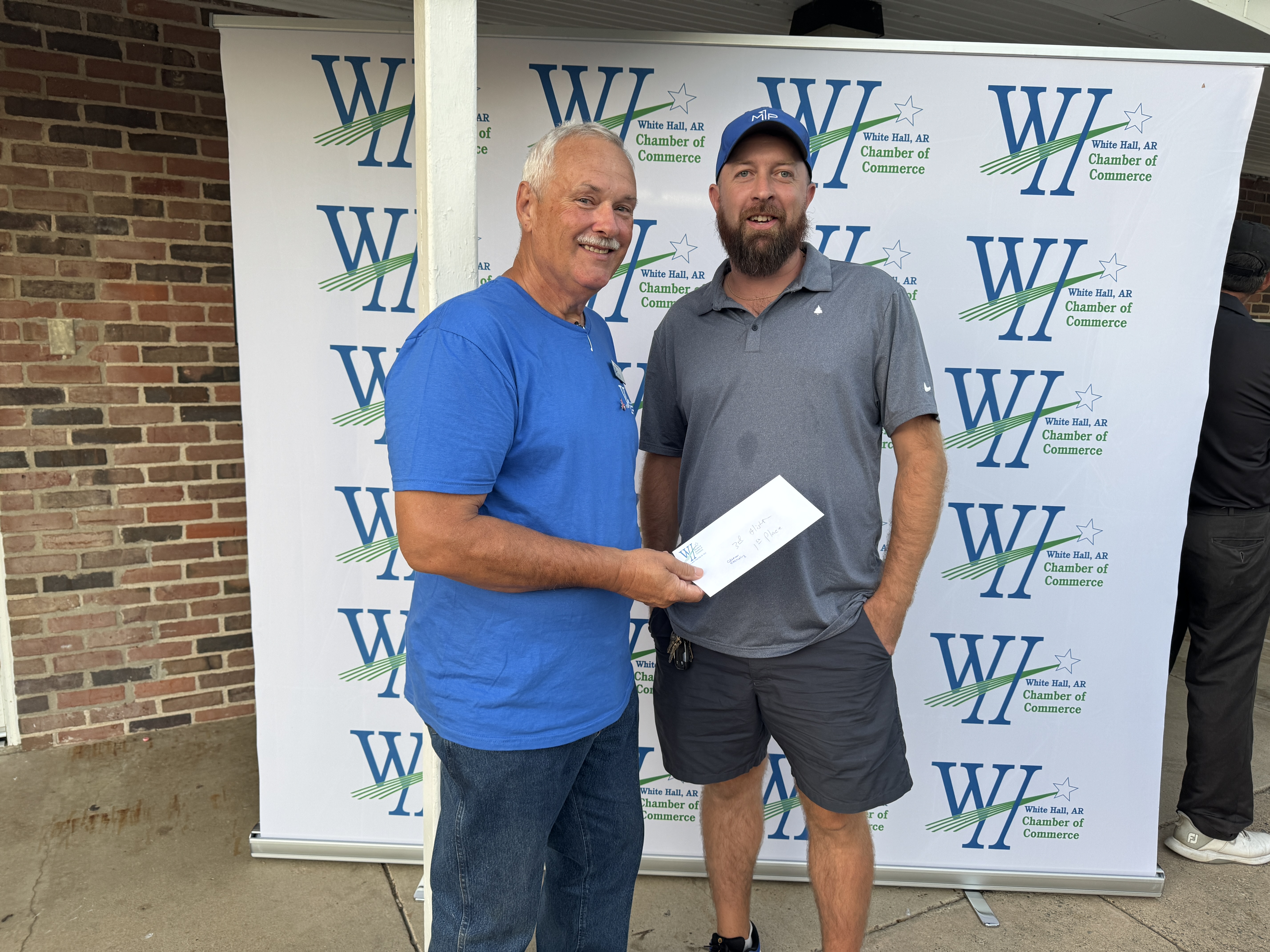 Joey Coleman receives his team's prize.